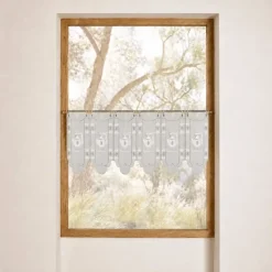 Brise-bise brodé à motifs théières