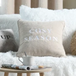 Coussin décoratif avec message brodé