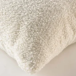 Coussin déhoussable en bouclette unie