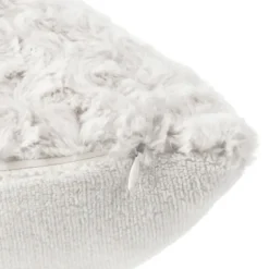 Coussin en imitation fourrure bouclée