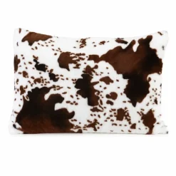 Coussin garni à motif peau de vache et dos en velours
