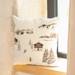 Coussin jacquard avec motif chalets