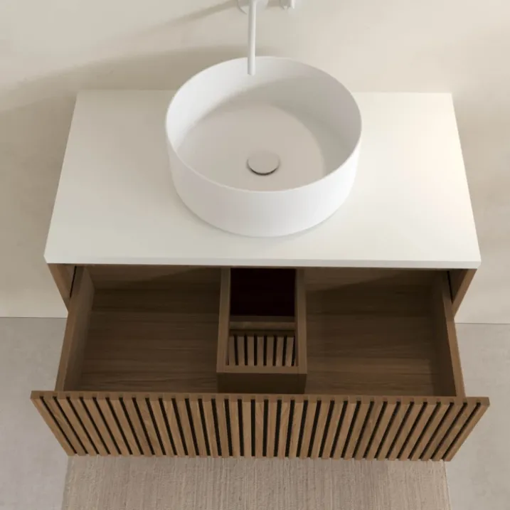 Meuble de salle de bain suspendu avec façade crantée, plan de toilette et vasque(s) à poser