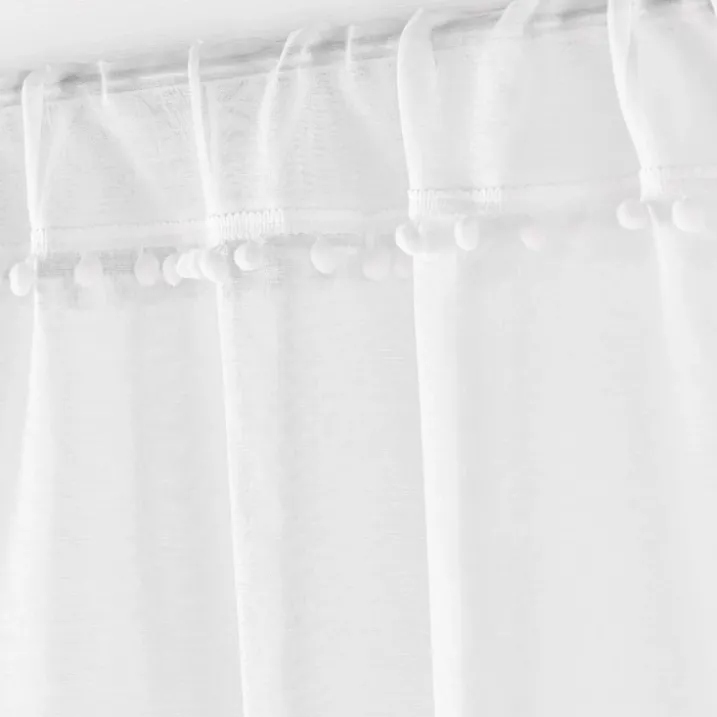 Paire de voilages passe-tringle en voile sablé avec finitions pompons