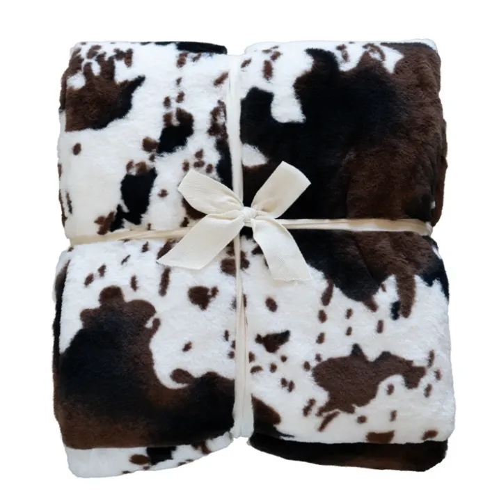 Plaid doux à motif peau de vache avec dos en velours