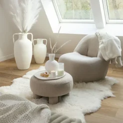 Pouf rond en tissu bouclé