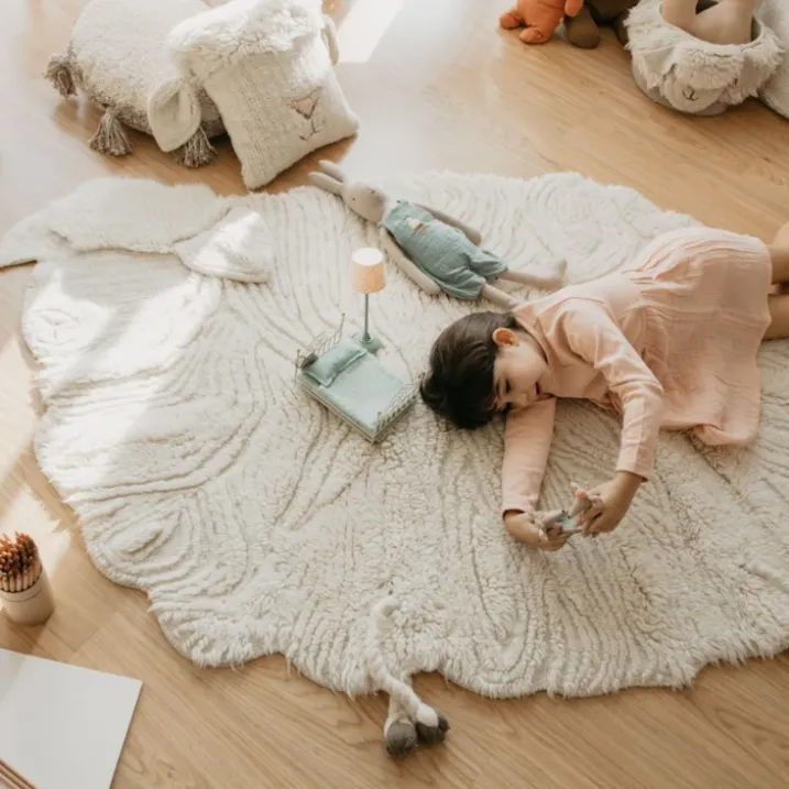 Tapis lavable en laine mouton au nez rose
