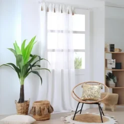 Voilage bohème à pompons en jute