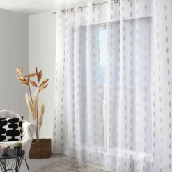 Voilage jacquard à pois ovales à oeillets
