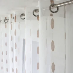 Voilage jacquard à pois ovales à oeillets