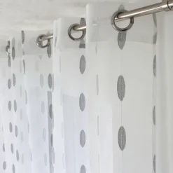 Voilage jacquard à pois ovales à oeillets